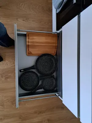 a kitchen cabinet with utensils in it at T3 avec vue montagne in Les Contamines-Montjoie