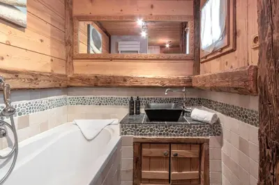 a bathroom with a bath tub and a sink at Le Gite - L'oréade - 6 pax in Saint-Gervais-les-Bains