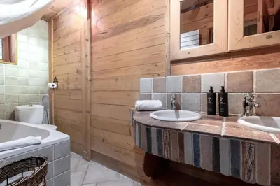 a bathroom with two sinks and a tub at Le Gite - Le Mont Blanc - 9 pax in Saint-Gervais-les-Bains