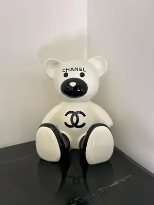 a teddy bear sitting on a table at Au pied du télécabine & gare St Gervais in Saint-Gervais-les-Bains