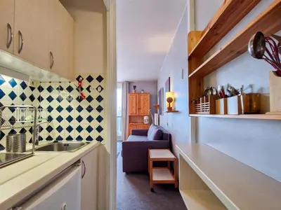 a kitchen with a sink and a living room at Studio lumineux avec balcon - Proche des pistes et commerces - FR-1-425-226 in Arâches-la-Frasse