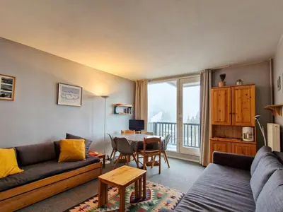 a living room with a couch and a table at Studio lumineux avec balcon - Proche des pistes et commerces - FR-1-425-226 in Arâches-la-Frasse