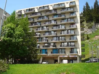 a large building with balconies on the side of it at Studio lumineux avec balcon - Proche des pistes et commerces - FR-1-425-226 in Arâches-la-Frasse