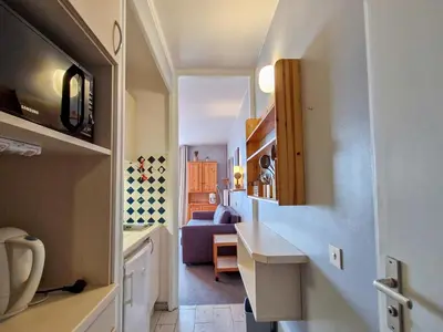 a small hallway with a kitchen and a living room at Studio lumineux avec balcon - Proche des pistes et commerces - FR-1-425-226 in Arâches-la-Frasse