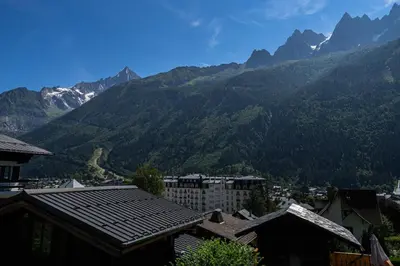 a view of a mountain range from a city at Rimaye Blanche - A bright and cozy 1 bed apartment in Chamonix-Mont-Blanc
