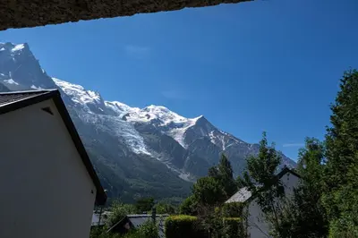 a view of a snow covered mountain from a house at Rimaye Blanche - A bright and cozy 1 bed apartment in Chamonix-Mont-Blanc