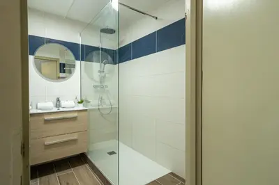 a bathroom with a shower and a sink at Bois des Fées - newly renovated central Chamonix apartment in Chamonix-Mont-Blanc