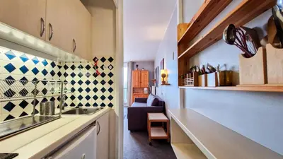 a kitchen with a sink and a counter top at Résidence Vega - Studio lumineux · Proche des pistes et des commerces · Balcon MAE-1641 in Magland