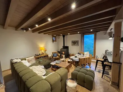 a large living room with couches and a fireplace at Chalet La Foge - Samoens x 14, skis aux pieds in Morillon