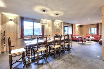 a dining room with a long table and chairs at Picherie bas - 10Pax - Calme - Vue montagne in Saint-Gervais-les-Bains