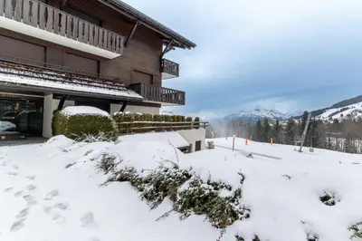 a ski lodge in the snow at Appartement à Megève skis aux pieds - La CABOCHE in Le Planellet