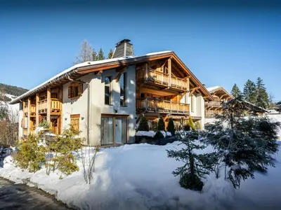 a log home in the winter with snow at Sundance Kid Loft - OVO Network in Megève