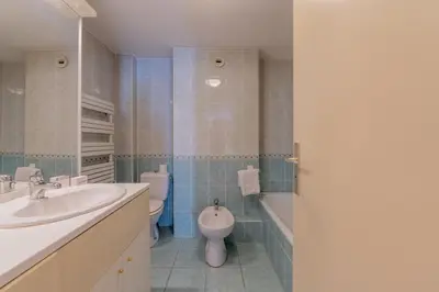 a bathroom with a sink and a toilet and a tub at Appartement De l'Aiguille Du Midi - Happy Rentals in Chamonix-Mont-Blanc