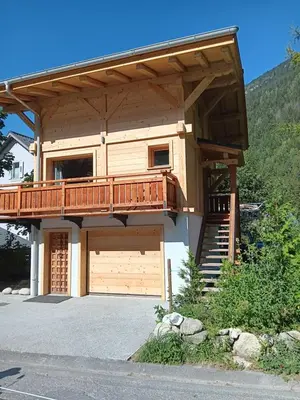 a house with a deck and a garage at Chalet rinette in Chamonix-Mont-Blanc