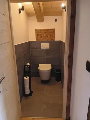 a bathroom with a toilet in a room at Chalet rinette in Chamonix-Mont-Blanc