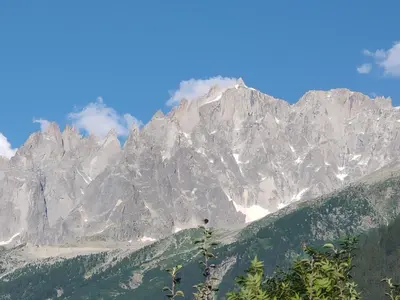 a view of a mountain range with snow at Beau studio dans la vallée de CHAMONIX in Les Houches