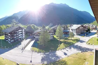 an aerial view of a resort with a mountain at Les Appartements Diochon in Le Baplieu
