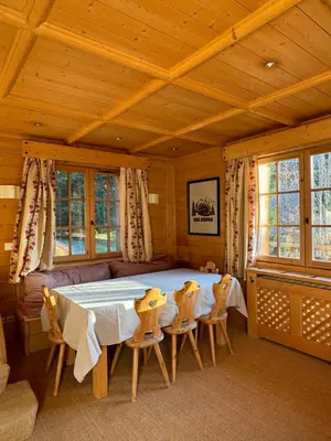 a bedroom with a large bed in a wooden room at Loue chalet Megève proximité pistes Rochebrune et centre-ville in Megève
