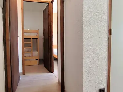 a door leading into a room with a closet at Appartement T3 familial rénové à Samoëns, animaux acceptés - FR-1-624-161 in Samoëns