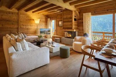a living room filled with furniture and a fireplace at Chalet Piccolo - OVO Network in Saint-Gervais-les-Bains