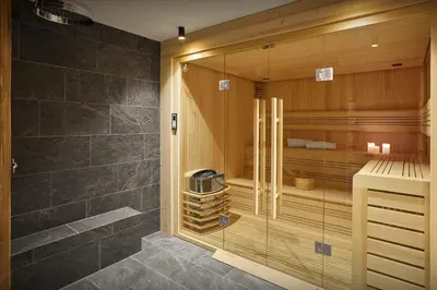 a shower with a glass door in a bathroom at Chalet Piccolo - OVO Network in Saint-Gervais-les-Bains