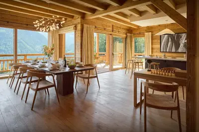 a dining room with a table and chairs in a cabin at Chalet Piccolo - OVO Network in Saint-Gervais-les-Bains