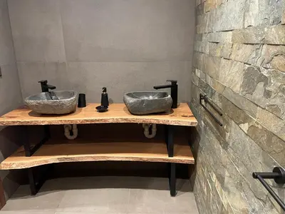 two sinks on a wooden counter in a bathroom at Chalet Cristal I in Les Contamines-Montjoie