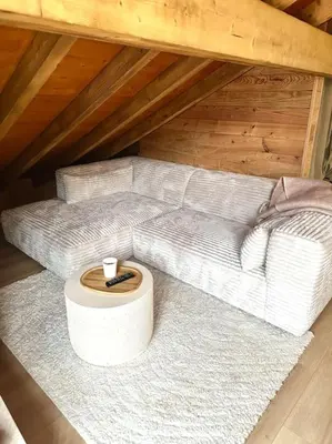 a room with a bunk bed and a wooden door at Le tilleul-cœur du village in Samoëns