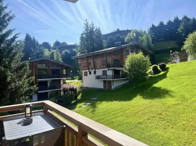 a room with two bunk beds and a window at Magnifique appartement au coeur de Megève in Megève