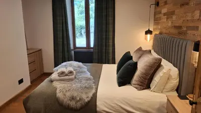 a living room with a couch and a table at Chalet OurSouris in Saint-Gervais-les-Bains