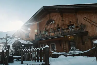 a wooden house with a balcony in the snow at La table de Fifine - Montagne - Appartement 65m2 in Samoëns