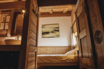a small room with a bed and a sink at La table de Fifine - Montagne - Appartement 65m2 in Samoëns