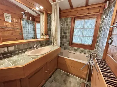 a bathroom with a sink and a tub and a window at Chalet 6-8 pers, 4 chambres, proche remontées, parking - FR-1-597-182 in Megève