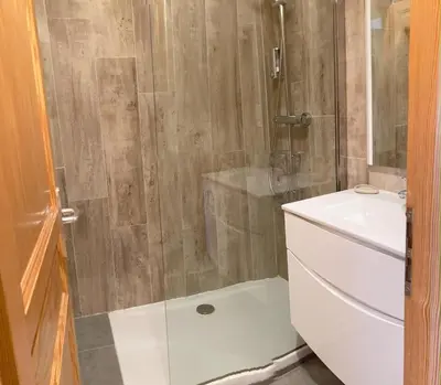 a bathroom with a shower and a toilet and a sink at Evasion Sérénité à Chamonix Mont-Blanc in Chamonix-Mont-Blanc