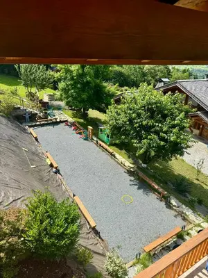an aerial view of a yard with a pond at Chalet les vergers in Sallanches