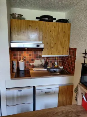 a kitchen with a sink and a counter top at studio plein SUD été comme hiver in Les Carroz d'Araches