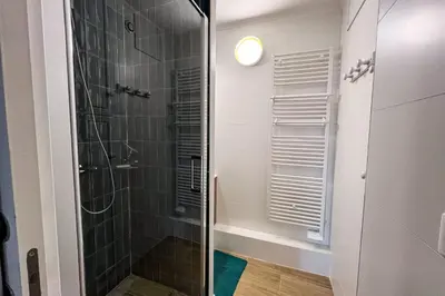 a bathroom with a sink and a mirror at Spacious T2 in the heart of Chamonix in Chamonix-Mont-Blanc