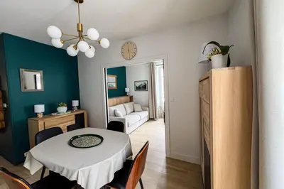 a kitchen and dining room with a table and chairs at Spacious T2 in the heart of Chamonix in Chamonix-Mont-Blanc