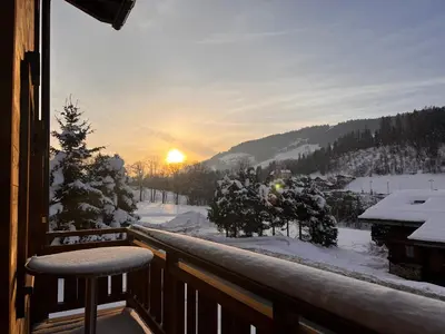 a balcony with a view of a snow covered mountain at Appartement Panthère in Demi-Quartier