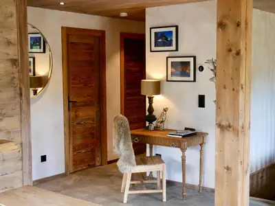 a room with a wooden desk and a chair at Appartement Panthère in Demi-Quartier