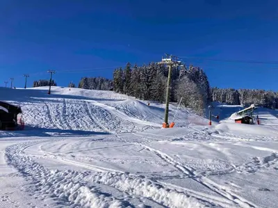 a snow covered ski slope with tracks in the snow at Appartement familial en résidence Saint Gervais les bains in Saint-Gervais-les-Bains