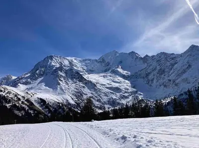 a snow covered mountain with ski tracks in the snow at Appartement familial en résidence Saint Gervais les bains in Saint-Gervais-les-Bains