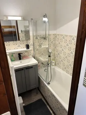 a bathroom with a shower and a tub and a sink at Résidence Ecrin Des Glacier Ecureuil - ECRIN DES GLACIERS ECUREUIL 4 MAE-4011 in Combloux