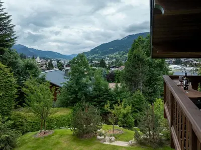 a view from the balcony of a house at Chalet Molitor, avec services, Collection Chalets des Fermes in Megève