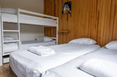 a bedroom with a bed with two towels on it at Comfort nature and exceptional Mont Blanc view in Chamonix-Mont-Blanc