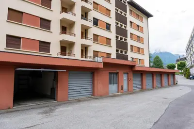 an empty parking lot in front of a building at Comfort nature and exceptional Mont Blanc view in Chamonix-Mont-Blanc