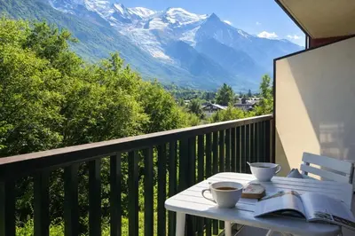 a balcony with a view of a snow covered mountain at Comfort nature and exceptional Mont Blanc view in Chamonix-Mont-Blanc