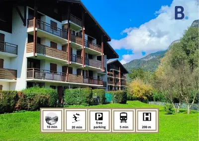 a building with a sign in front of it at Résidence Vallée Blanche in Sallanches