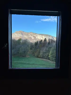 a view of a mountain from a window at Studio vue montagne à 200m des pistes in Arâches-la-Frasse