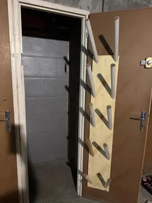 a door with a bunch of knives on it at Studio vue montagne à 200m des pistes in Arâches-la-Frasse